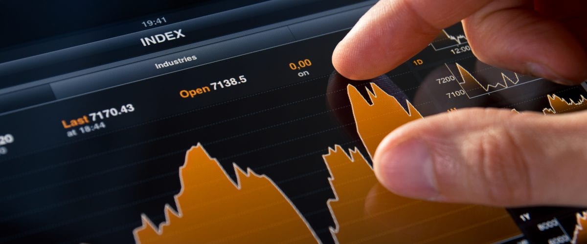 Analyzing stock market graph on a touch screen device.