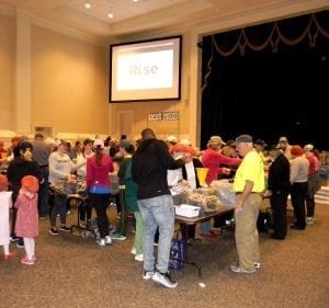 <em>Volunteers of all ages worked together to pack more than 300,000 meals last month at Canterbury UMC.</em>