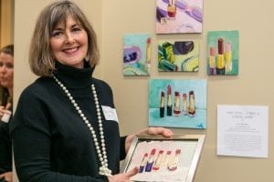 Artist Jill McCool with her series of paintings "Mom's Lipsticks - A Tribute to a Beautiful Woman".