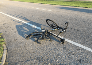 <em>While riding his bike June 26, 2017, Thomas Waters was struck by a hit and run driver in Irondale. Fellow cyclists, Al Schlosser and Rex Seaborn, helped Waters to safety.</em>