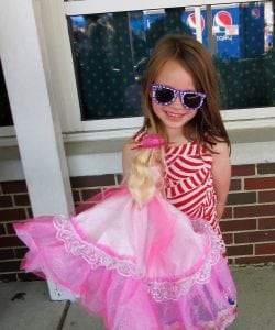 A patriotic living doll won a doll from the doll booth at the 69th annual Independence Day Festival at OLS.