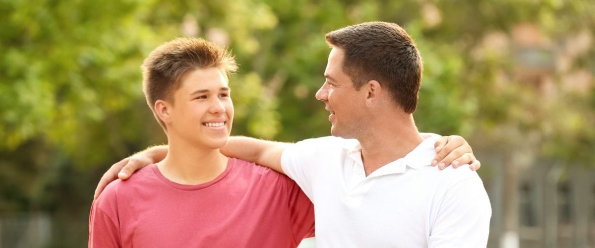 bigstock Teenager boy with father in pa 209063731