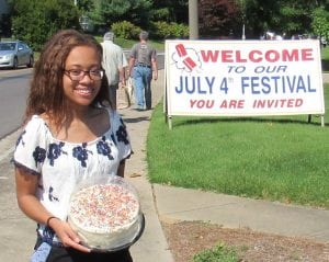 Samantha Chriesman brings her homemade cake for the cake booth