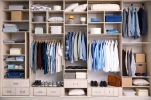 bigstock Big wardrobe with male clothes 227186326