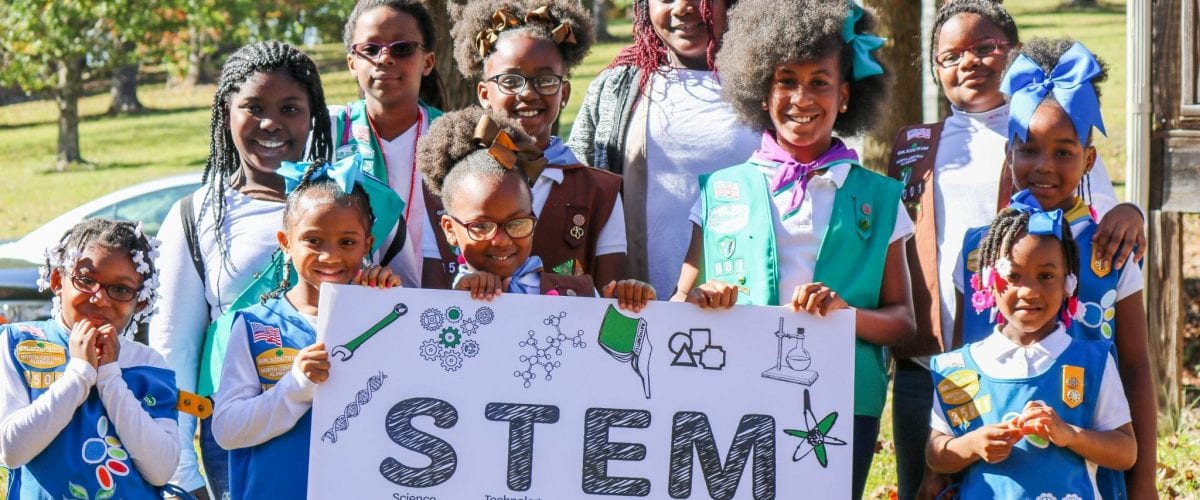 Photo Fun Girl Scouts STEM group with poster