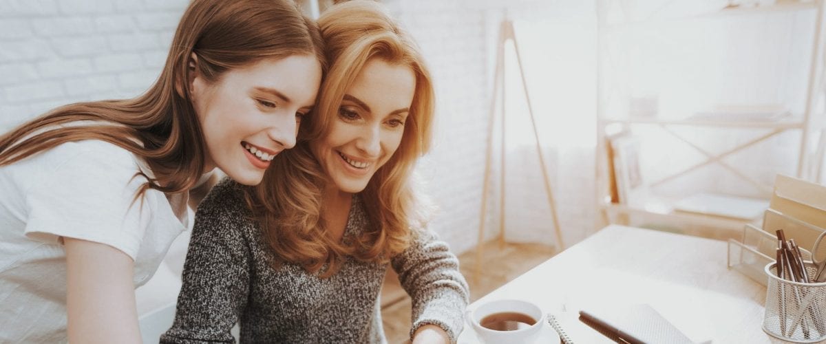 bigstock Mother And Daughter Watching I 252935194