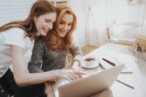 bigstock Mother And Daughter Watching I 252935194