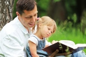 bigstock Father and daughter reading 33993602