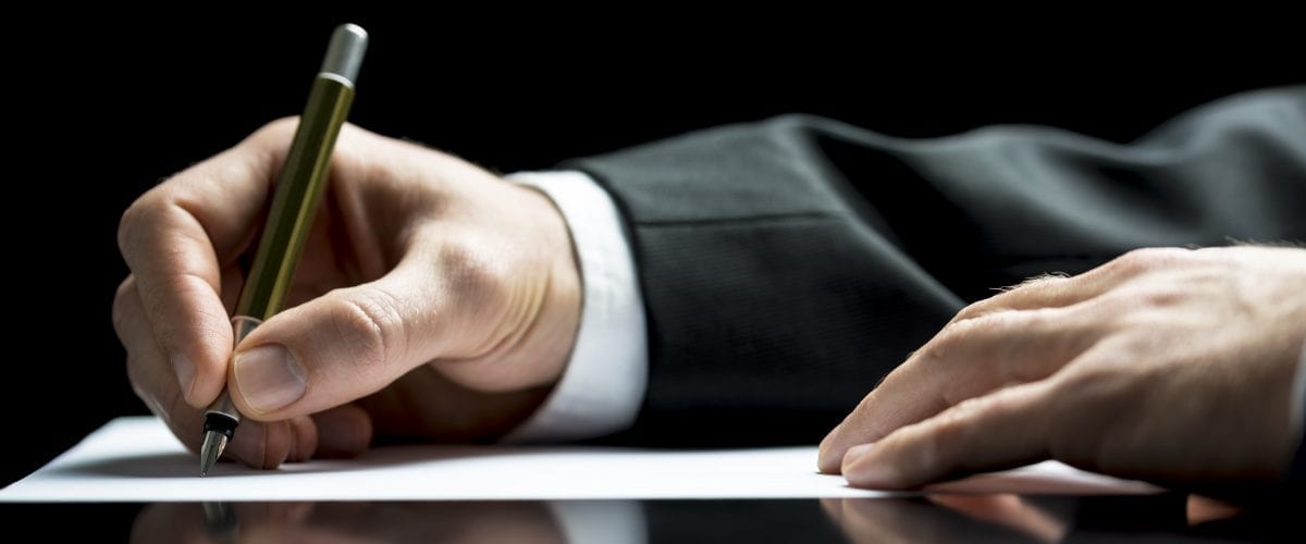 bigstock Businessman Writing A Letter O 57436670