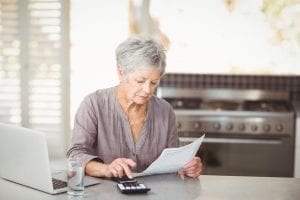 bigstock Senior woman using calculator 167417714