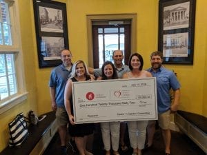 Justin and Heather Stroud (far right), along with two of the other organizing families for Castin’ ‘N Catchin’, hold a check with the total amount of funds raised during the 2018 tournament. $120,062.32 went directly to Children’s of Alabama and the Pediatric and Congenital Heart Center of Alabama.
