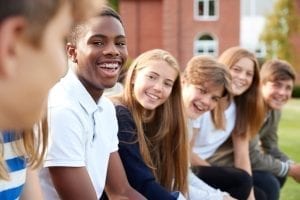 bigstock Group Of Teenage Students Sitt 219305932