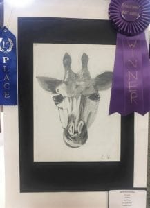 Prince of Peace Eighth grade student Nick Hernandez’s drawing of a giraffe won the best of the best at the diocesan art show and is on display in the Diocese of Birmingham’s office.