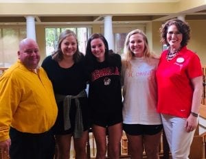 Brookdale Dining Services Director, Joe Sciarrotta (far left) and Brookdale Business Development Coordinator Leanne Messer (far right), welcome Samford students to the Senior Living center in Homewood.