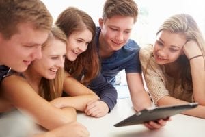 Epic Curriculum Article 5 teens looking at 1 iPad