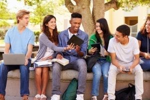 Epic Curriculum Teens Outside looking at Ipads