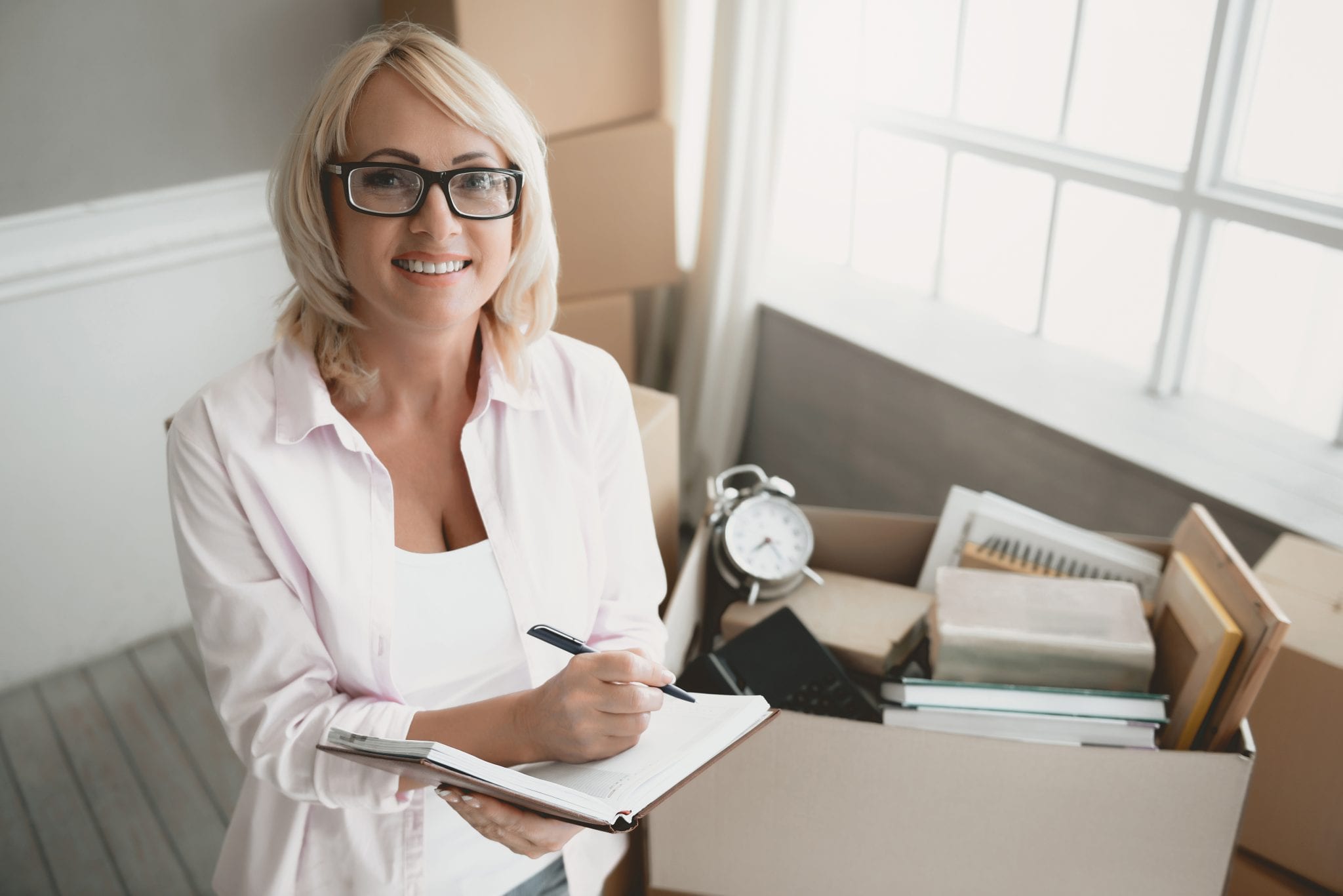 bigstock Smiling Blond Woman With Glass 251802673