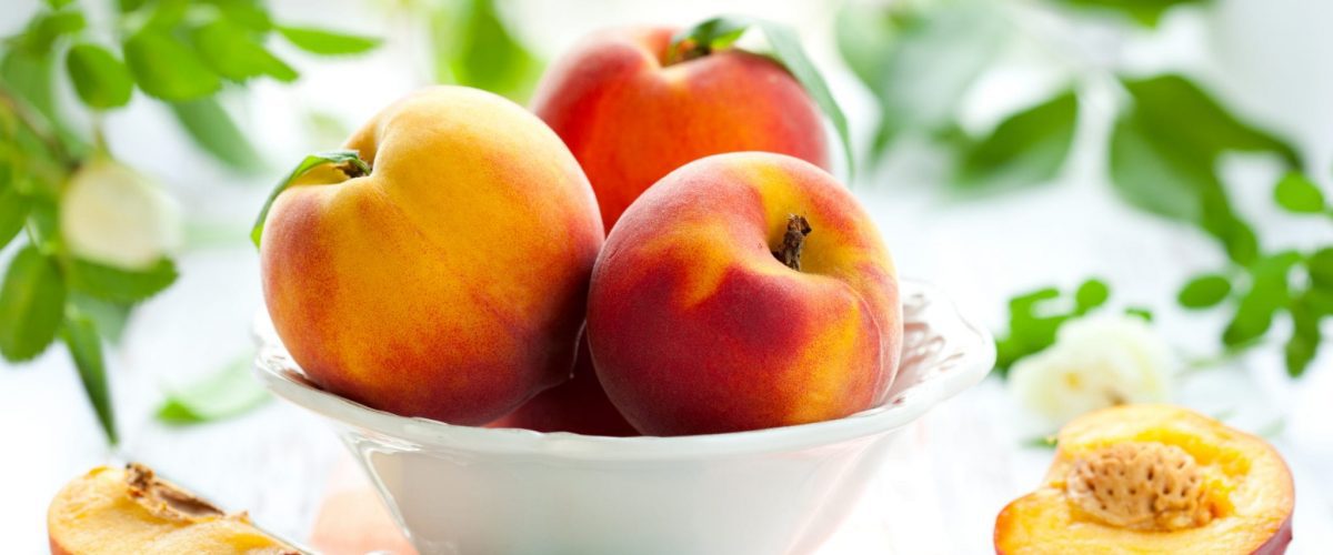 bigstock Bowl of fresh peaches on the t 12230318