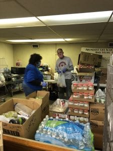 Volunteers sorting food for "I Cared Enough"