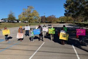 Senior Scene Hoover Senior Center Food Drive People Holding Colorful Signs