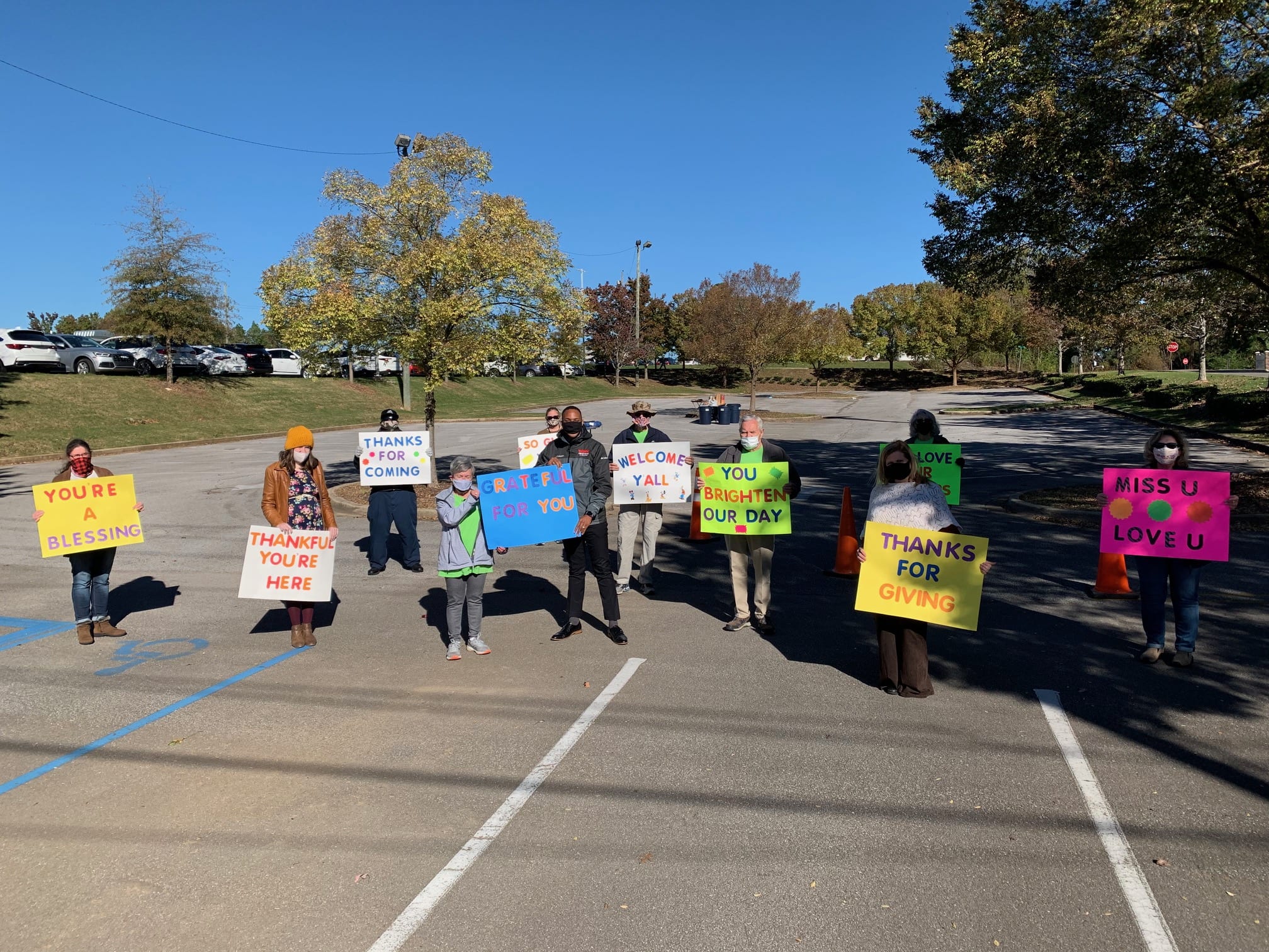 Senior Scene Hoover Senior Center Food Drive People Holding Colorful Signs