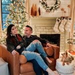 Charlotte and her husband Jon sitting by their fireplace