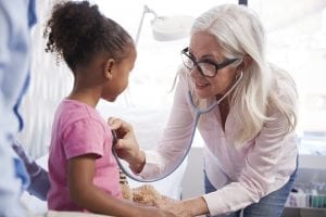 father with daughter in consultation with doctor i G2ZQ7S4