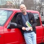 William Roberts Beside His Red Truck