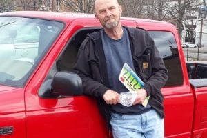 William Roberts Beside His Red Truck