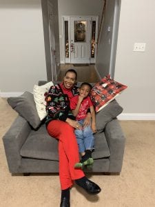 Andrea Whitfield with grandson on couch