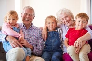 Grandparents sitting with grandchildren