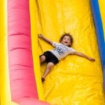 Child Sliding Down Inflatable