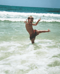 Trae playing in the waves