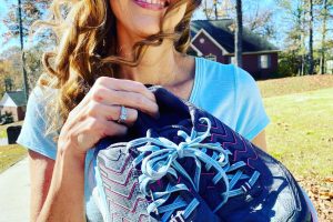 Kim Robinson with her Hokas