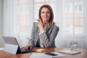 Woman behind a desk working