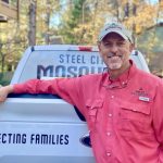 Steel City John Sims with company truck