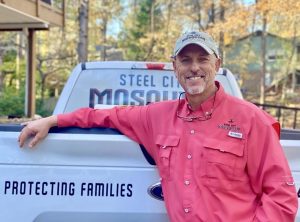 Steel City John Sims with company truck