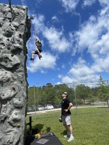 Child climbing rock wall