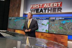 Cover Story Wes Wyatt behind weather desk 1