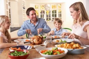 bigstock Happy family having roast chic 13921556