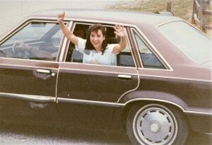 Ranell waving from car