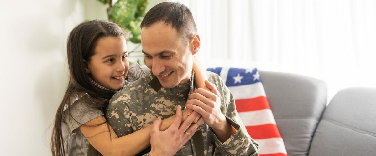 bigstock A Child Girl Hugs A Military F 453584699