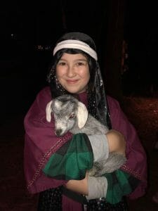 Special Feature Live Nativity girl holding lamb