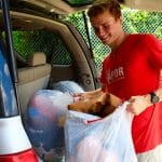 Vapor Ministries volunteer unloading car