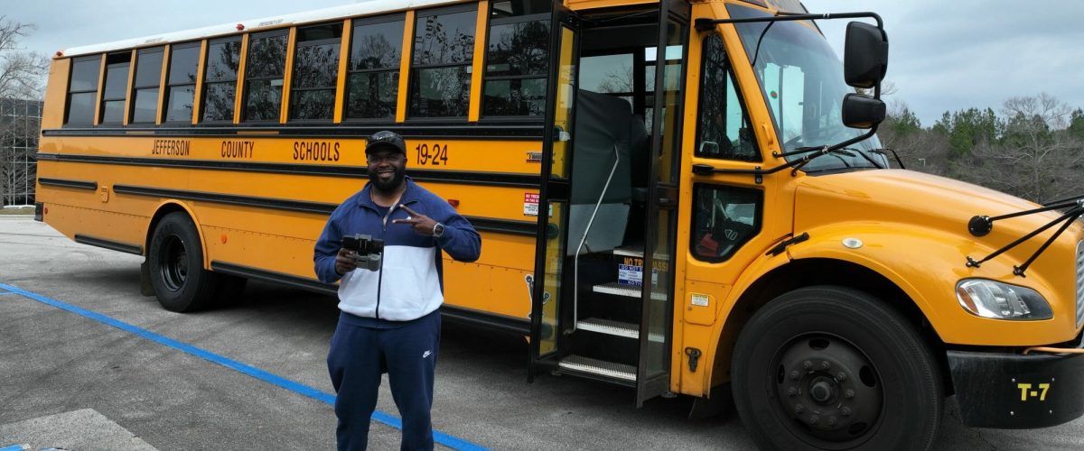 PJ in front of school bus