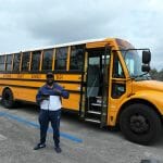 PJ in front of school bus