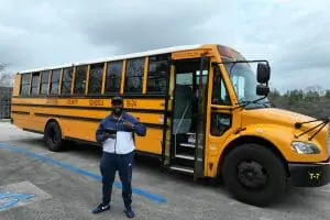 PJ in front of school bus
