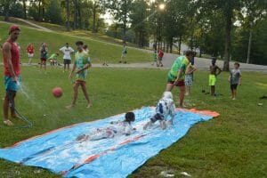 Royal Family Kids Camp kids on a wet slide