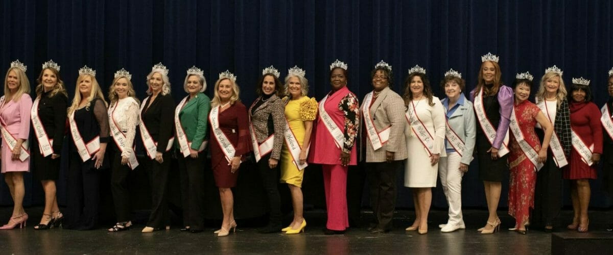 Senior ladies on stage with sashes