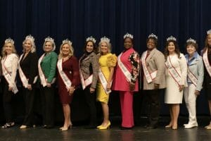 Senior ladies on stage with sashes